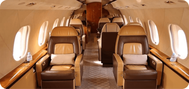 Private jet cabin with brown leather seats